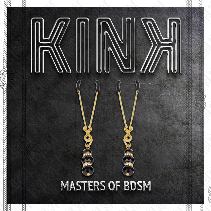 KINK – Pincette à tétons dorées avec ornements bijoux noirs